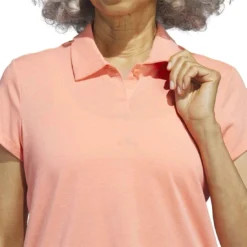 Adidas 2023 Women's Go-To Heathered Polo -Pum Golf Club Shop adidas 23 womens go to heathered polo coral fusion detail1 itempicture