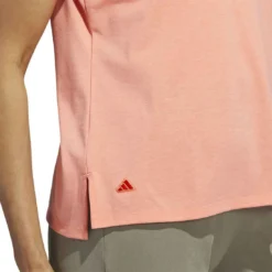 Adidas 2023 Women's Go-To Heathered Polo -Pum Golf Club Shop adidas 23 womens go to heathered polo coral fusion detail2 itempicture