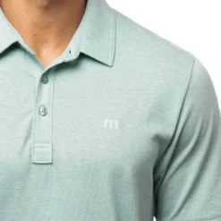 TravisMathew The Zinna Polo -Pum Golf Club Shop travismathew 2023 the zinna polo heather bearl green logo itempicture