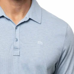 TravisMathew The Zinna Polo -Pum Golf Club Shop travismathew 2023 the zinna polo heather light blue logo itempicture